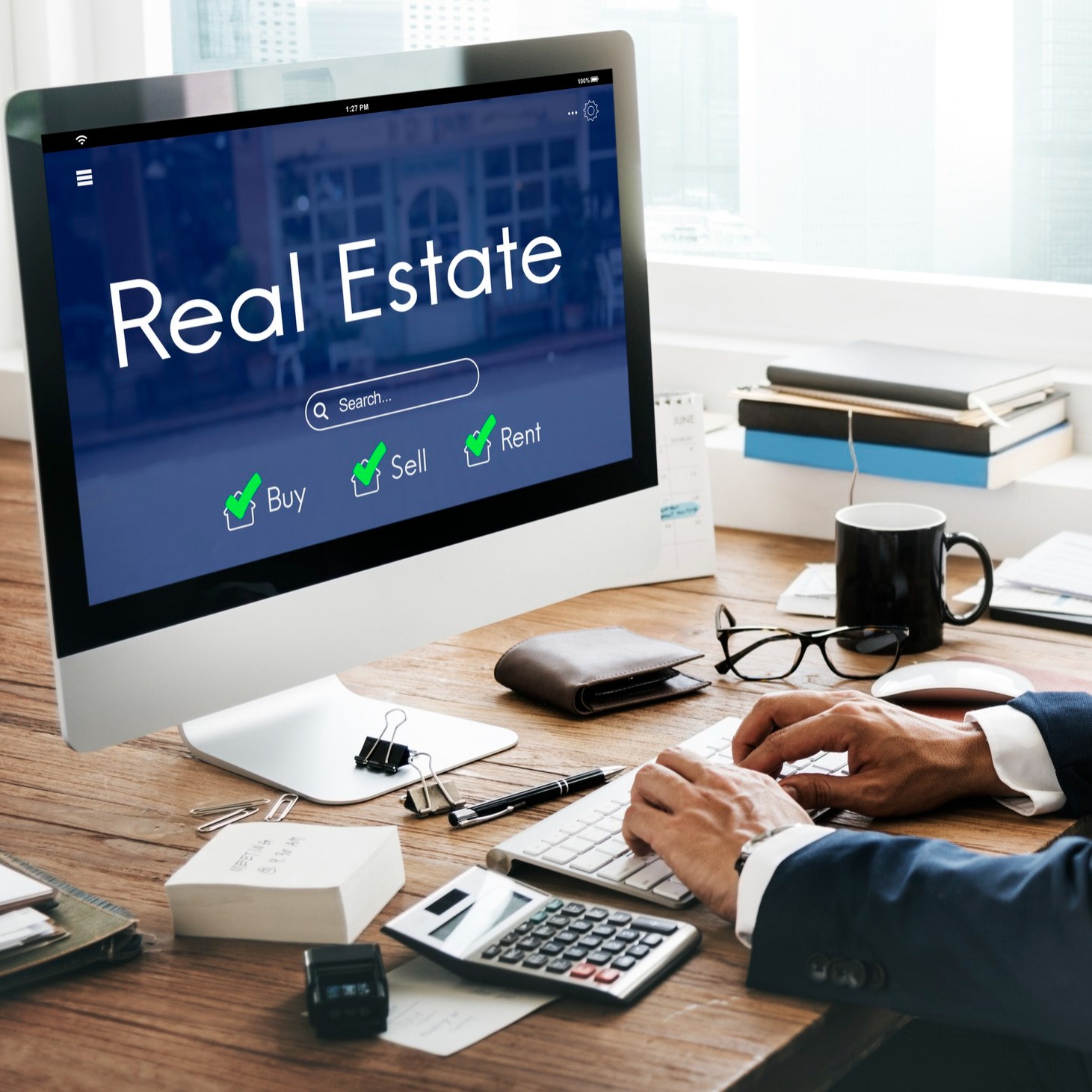 Real estate agents collaborating using management software for client and property tracking